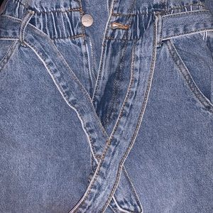 Girls blue jeans with belt
